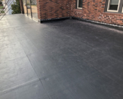 Wisconsin Roofing LLC | Flat Decks | Residential | Brick Edge