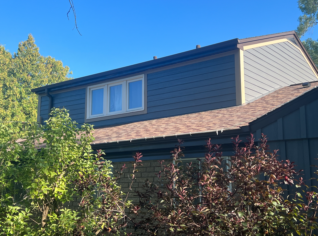 Wisconsin Roofing LLC | Siding | New LP with Vertical Baton Accents | Replaced Cedar | Back View